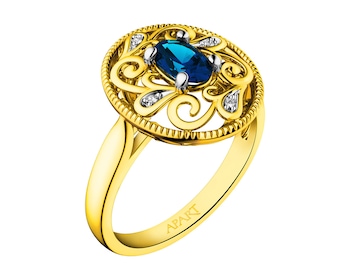 Ring made of white gold with diamonds and sapphire - fineness 14 K