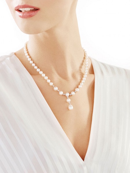 Pearl necklace with white gold elements and brilliants - fineness 14 K