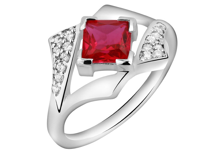 Ring with cubic zirconias and synthetic corundum
