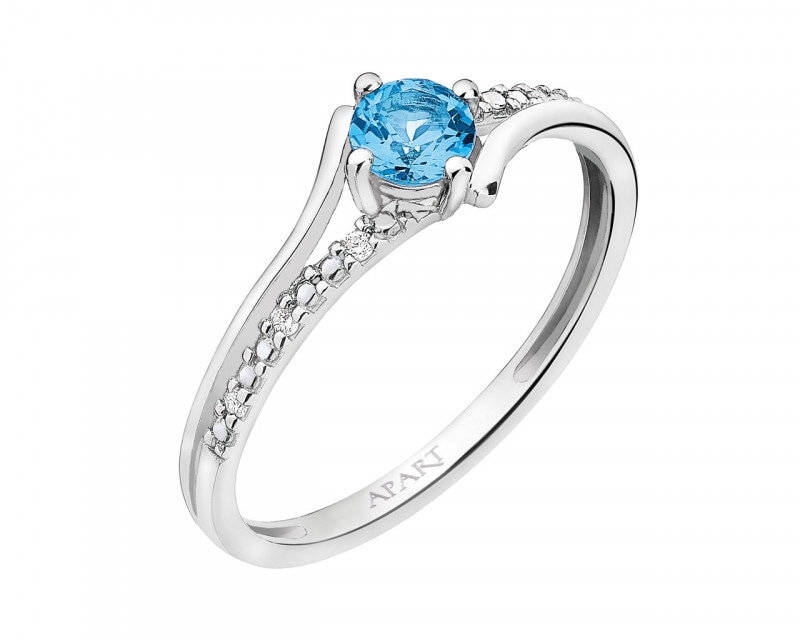 White gold ring with diamonds and topaz - fineness 9 K