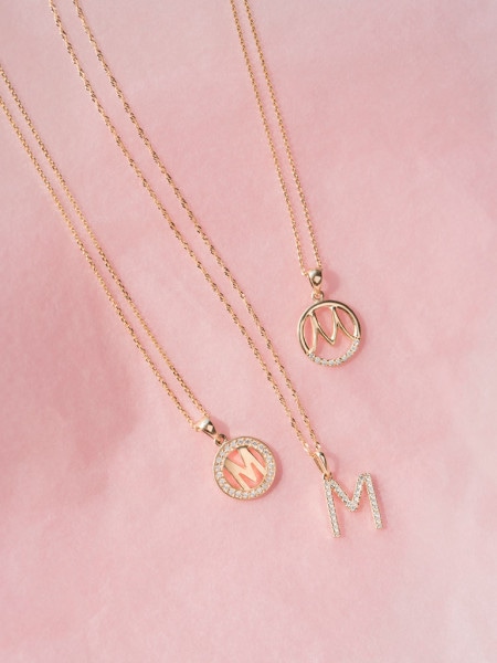 Gold pendant with cubic zirconia - letter M