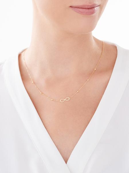 Yellow gold necklace with infinity sign