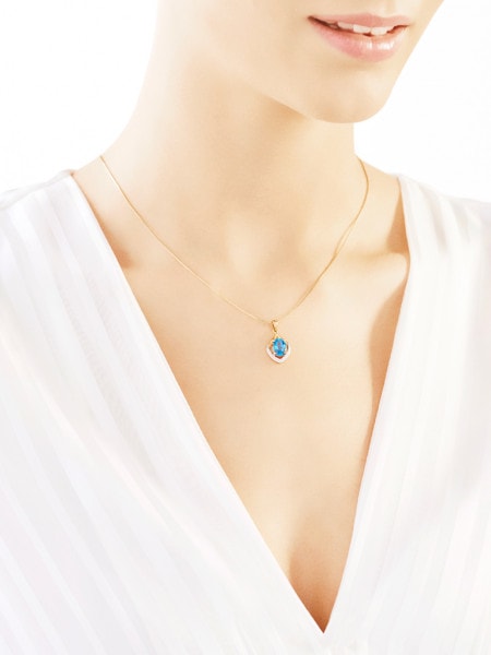 Yellow gold pendant with diamonds and topaz - fineness 18 K