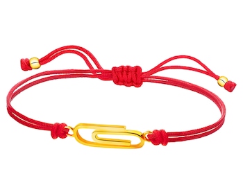 Bracelet with elements of yellow gold - paper clip