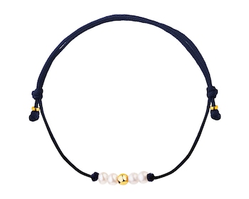 Bracelet with elements of yellow gold and pearls - ball