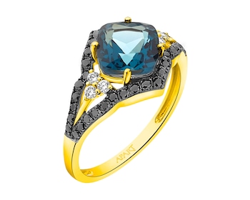 Yellow gold ring with diamonds and topaz (London blue) 0,35 ct - fineness 14 K