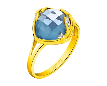 Pierścionek z żółtego złota z diamentami i topazem (London Blue) 0,01 ct - próba 585