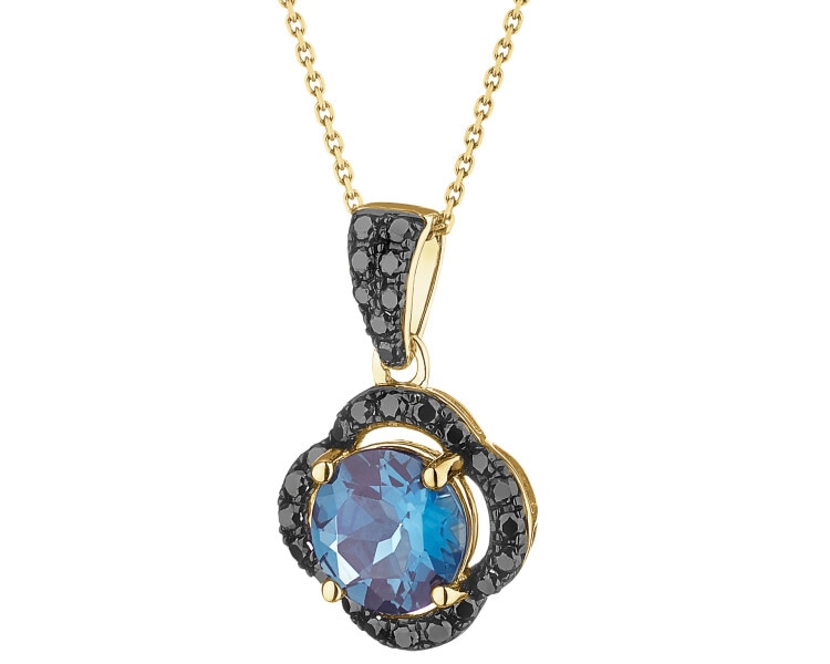 Zawieszka z żółtego złota z czarnymi brylantami i topazem London Blue - próba 585