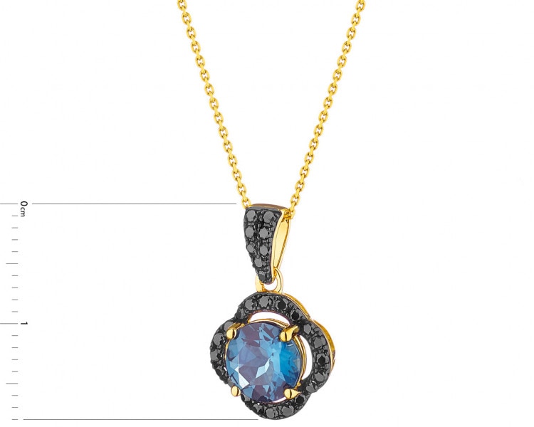 Gold pendant with diamonds and topaz (London Blue) - fineness 14 K