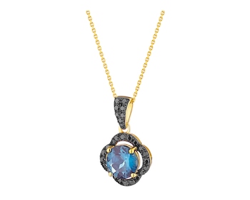 Gold pendant with diamonds and topaz (London Blue) 0,24 ct - fineness 14 K