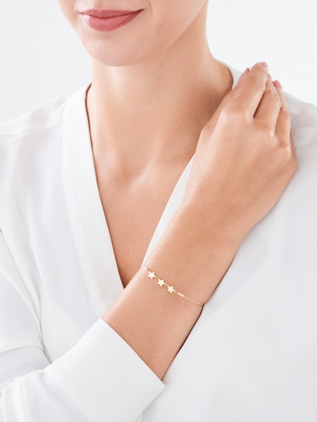 Gold rigid bracelet with a clasp - stars