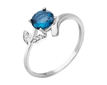White gold ring with natural topaz and zircons