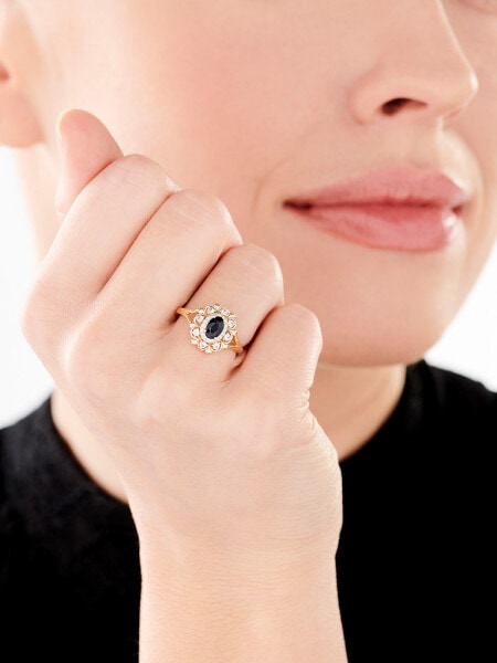 Ring made of white gold with diamonds and sapphire - fineness 14 K