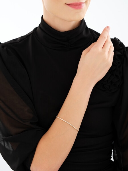 Zlatý náramek se zirkony