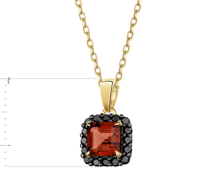 Zawieszka z żółtego złota z czarnymi brylantami i granatem - próba 585