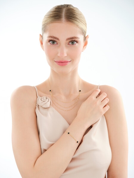 Złota bransoletka z onyksami syntetycznymi - koniczyny