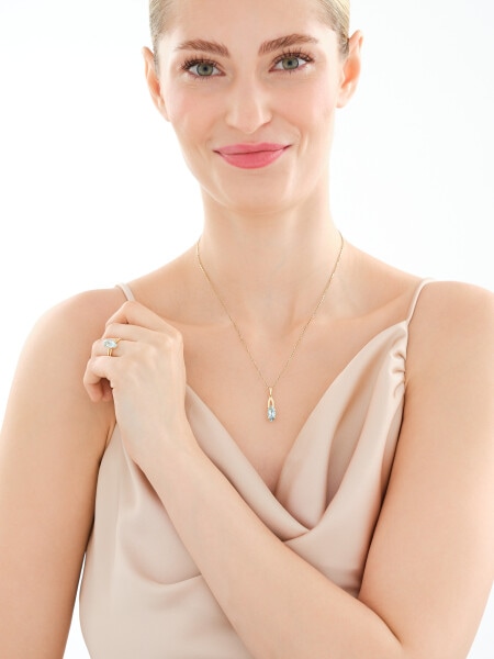 Złota zawieszka z topazem i cyrkoniami