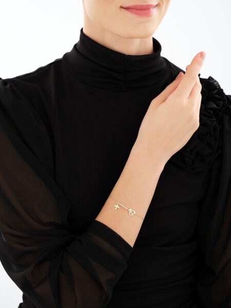 Złota bransoletka z cyrkonią - serce, mapa świata, kulki, samolot