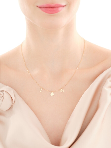 Złoty naszyjnik - łapka, serce, kość