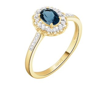 Pierścionek z żółtego złota z diamentami i topazem London Blue - próba 585