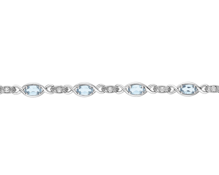 White gold bracelet with diamonds and topazes - fineness 9 K